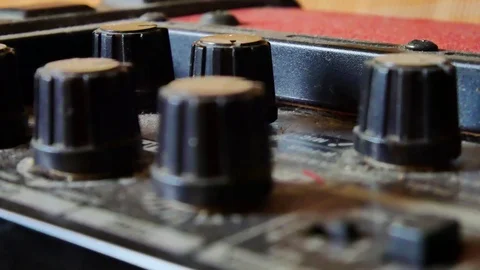Slow slider closeup view of tuning knobs on top of guitar amplifier 動画素材 100225751