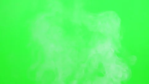 Slow smoke flow on green screen background Stock Footage 247204010