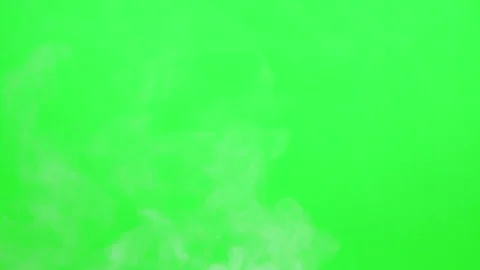 Slow smoke flow on green screen background Stock Footage 247204149