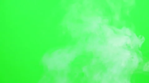 Slow smoke flow on green screen background Stock Footage 247204234