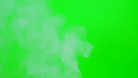 Slow smoke flow on green screen background Stock Footage 247204826