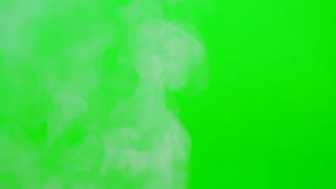 Slow smoke flow on green screen background Stock Footage 247205016