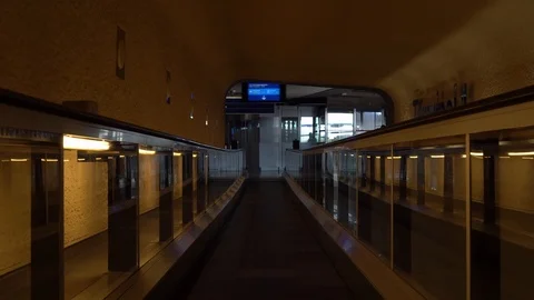 Slow smooth movement on a horizontal escalator. Corridors of the airport. 4K Stock Footage 121437224