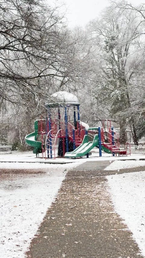 Slow snow flakes drift at Playground creating an enchanting view Stockbeeldmateriaal 334802662