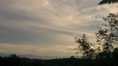 Slow soft clouds drifting in opposite direction at sunset Stock Footage 346791764