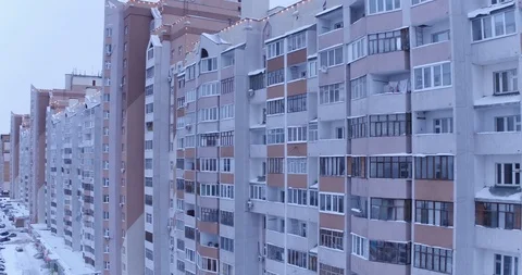 Slow span on a copter near the windows of houses in winter. Dormitory area Stock Footage 122325261