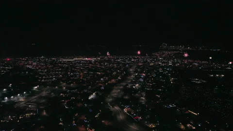 Slow spectacular cityscape with exploding fireworks. Dolly forward Stock Footage 228156812