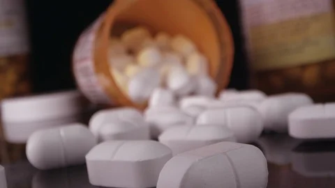 Slow spinning view moving in towards prescription drugs Stock Footage 99011865