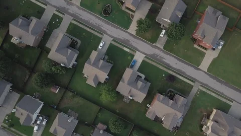 Slow straight drone fly over of established subdivision with newer homes. Stock Footage 91584405