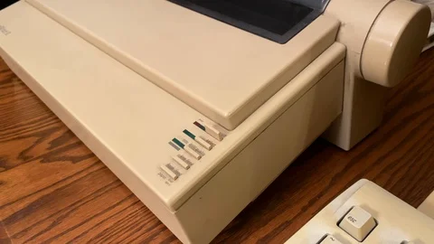 Slow tilt up of Apple Image Writer II dot matrix printer from Stock Footage 124157615