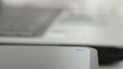 Slow tilt data saving from laptop computer to USB external hard disc Video stock 74551721