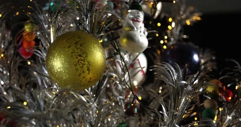 Slow Tilt Down Closeup of Colorfully Decorated Aluminum Christmas Tree Stock Footage