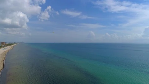 Slow Tilt-Down Drone Shot of Ocean and Beach Stock Footage 95818112