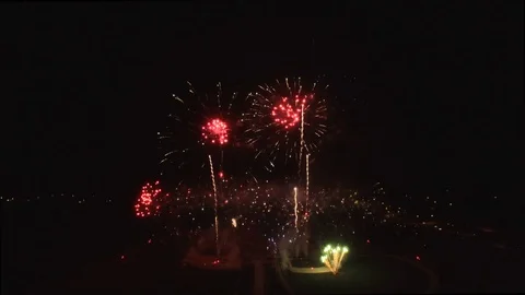 Slow tilt down with fast low and mid fireworks center Stock Footage 90256517