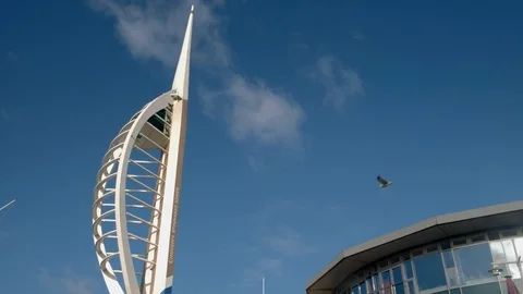 Slow tilt down Spinnaker Tower, in Gunwharf Quays Stock Footage 125669167