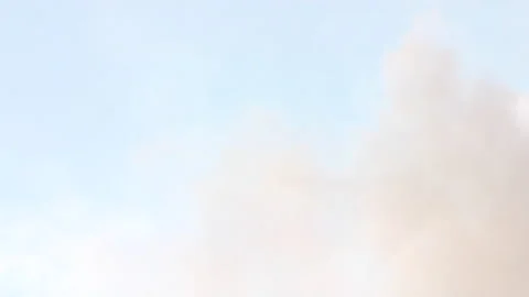 Slow Tilt Down from Sunset Clouds to Snowy Mountain Shrouded in Storm Clouds Stock Footage 198866380