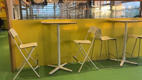 Slow Tilt-Up of Empty Cafe Chairs and Table at Sunset Stock Footage 333223126