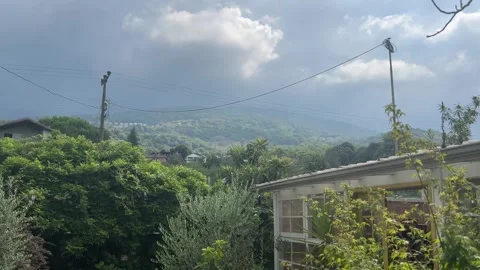 Slow Tilt Up from Lush Garden to Dramatic Mountain Sky in Sapanca Turkey Stock Footage 342279326