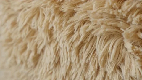 Slow tilt over the brown teddy bear surface 4K footage Stock Footage 132902362