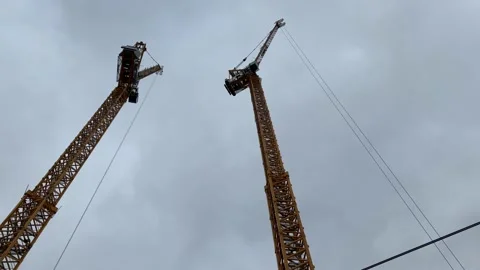 Slow tilt shot of two construction site cranes, West Croydon, UK, 4K Stock Footage 171409132