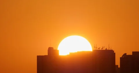 Slow Time-Lapse of Sunrise, Sun rising timelapse behind the building Stock Footage 87033225