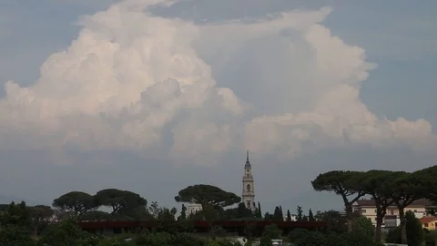 Slow timelapse storm building up above Italian village Stock Footage 104804093