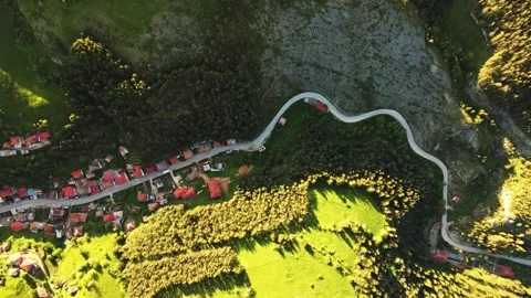 Slow Top Down Flight Over a Road Rural Mountain Area Hidden Healthy Off the Grid Stock Footage 289570070