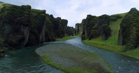 Slow tracking aerial view of exotic green valley in Iceland Видео 79834980
