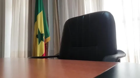 Slow Tracking backward Shot of Empty Office with Senegal Flag Stock Footage 294204227