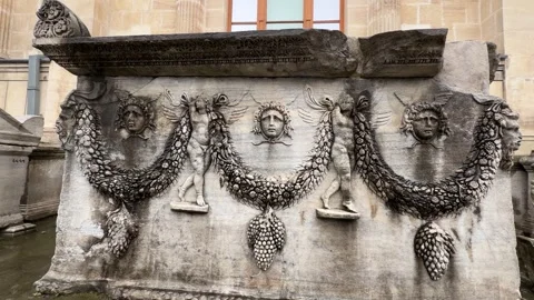 Slow tracking shot across the stone carvings and bas-relief sculptures of an Stock Footage 340155005