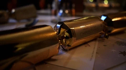 Slow tracking shot of Christmas cracker with message on the front Stock Footage 106810658