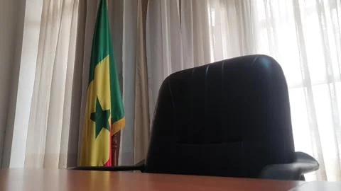Slow Tracking Shot of Empty Office with Senegal Flag Stock Footage 294205397
