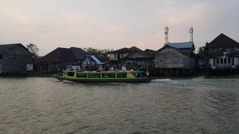 Slow tracking shot exploring by boat on a river 8 Stock Footage 249153061