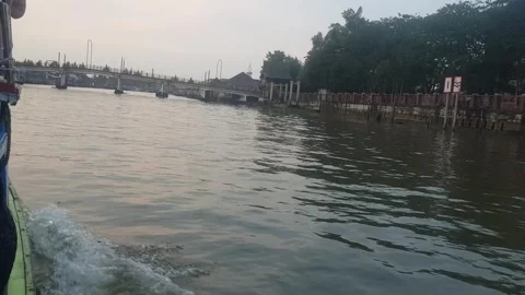 Slow tracking shot exploring by boat on a river 6 Stock Footage 249153264