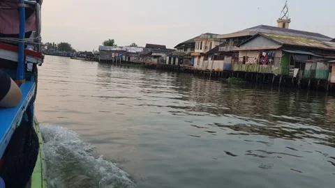 Slow tracking shot exploring by boat on a river Stock Footage 249153815