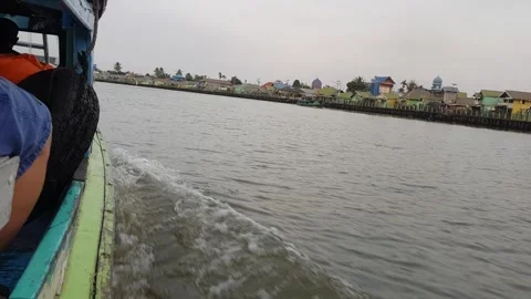 Slow tracking shot exploring by boat on a river 7 Stock Footage 249153858