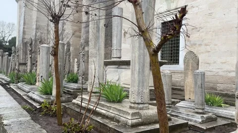 Slow tracking shot exploring the Ottoman tombstones with Arabic calligraphy Stock Footage 340154871