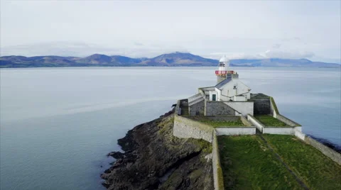 Slow tracking shot of lighthouse on rock Stock Footage 62568290