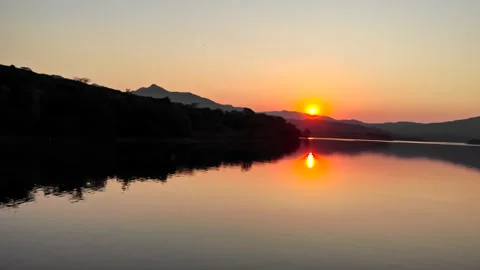 Slow tracking shot over a river at sunset Stock Footage 254779711