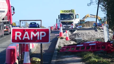 Slow traffic passing construction on the new east leeds orbital road uk Stock Footage 213567313