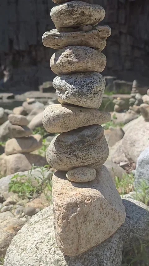 Slow Upward Camera Move Along Wish Stone Cairn from Bottom to Top Stock Footage 336346456