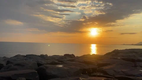 Slow Upward Camera Movement Toward a Glowing Sunrise Stock Footage 347730477