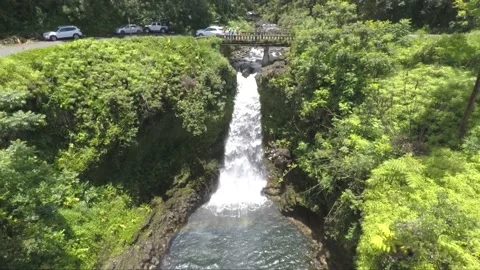 Slow upwards revealing shot of Makapipi Falls, Haiku, Maui, Hawaii Stock Footage