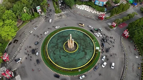 Slow Vertical Ascent Drone Shot of Tugu Digulis Roundabout Traffic Stock Footage 333498554