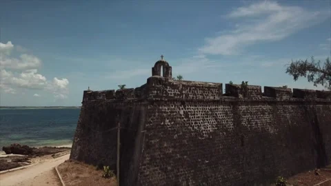 Slow vertical drone rise revealing the historic ramparts of Fort São Sebastião Video stock 345003357