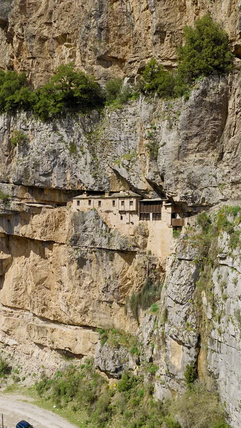 Slow vertical drone shot approaching the Holy Kipinas Monastery in Tzoumerka Video stock 343866041