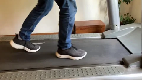 Slow walk on a treadmill.  Stock Footage 318167343