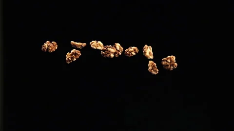 SLOW: Walnuts fly up and fall Vídeo Stock 49065346