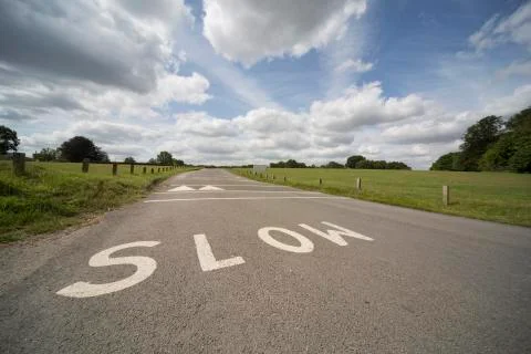 SLOW writen in road Stock Photos