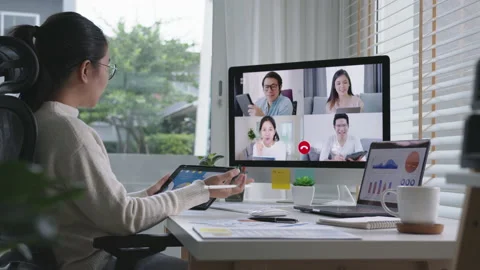 Slow zoom in business woman talking about sale report in video conference Stock Footage